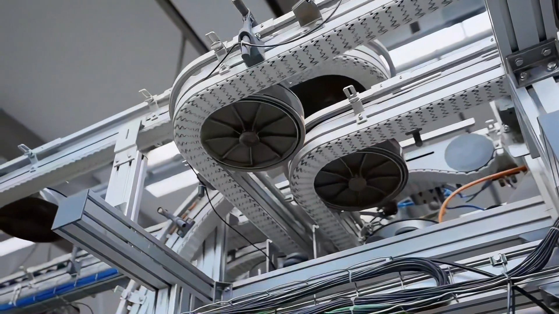 Automated tin conveyor system between production stations