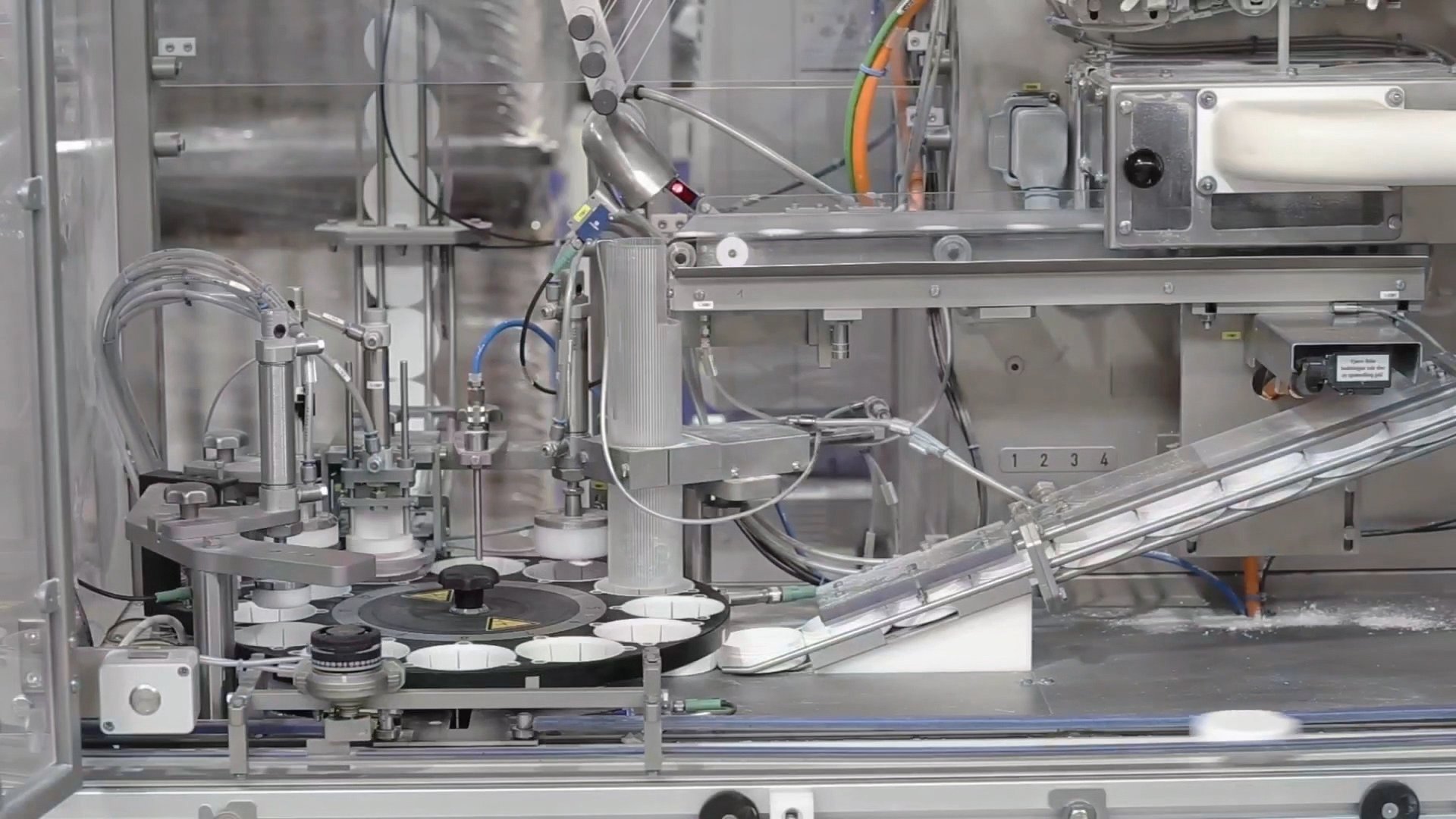 Tin filling machine on our nicotine pouch production line