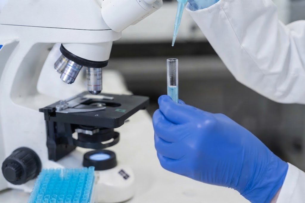 Quality control technician testing a sample in the lab